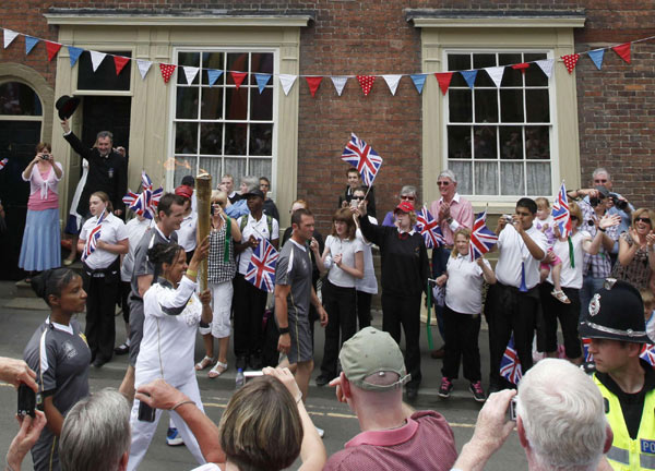 The flame was carried through Wales on day 11 of the Torch Relay, as part of the London 2012 Olympic Games. Olympic torch relay continues across Wales