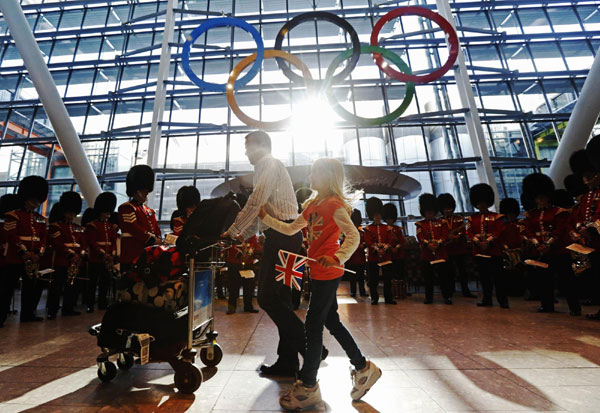 Olympic Rings are revealed during an unveiling ceremony in the Terminal Five arrivals hall at Heathrow Airport, in preparation for the London 2012 Olympic Games in London. Airport unveils Olympic Rings for London Game