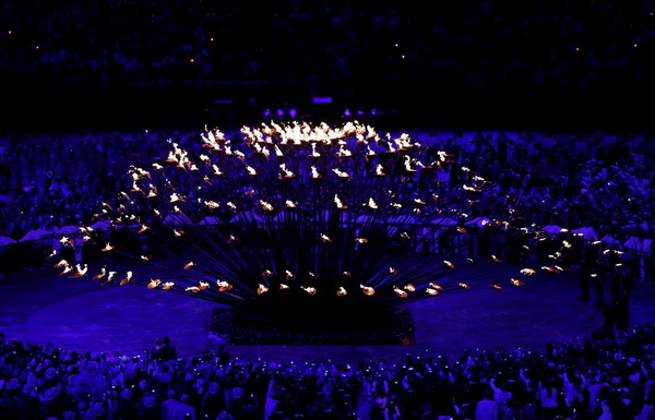Seven teenagers light Olympic cauldron