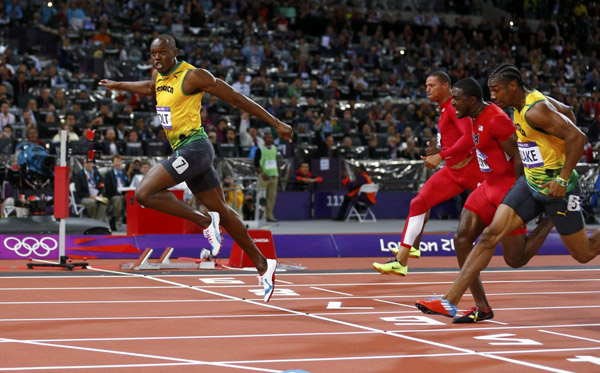 Jamaica's Usain Bolt crosses the finish line ahead of Ryan Bailey of the U.S. (2nd L), Justin Gatlin of the U.S. (2nd R) and Jamaica's Yohan Blake (R) to win the men's 100m final during the London 2012 Olympic Games at the Olympic Stadium August 5, 2012. Bolt set an Olympic record with a time of 9.63 seconds, while Blake finished secodn and Gatlin third. Brilliant Bolt scorches to 100m gold