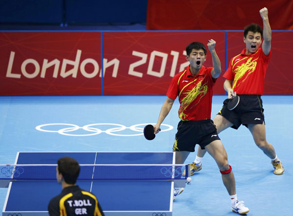China's Zhang Jike and Wang Hao (R) celebrate a point against Germany's Timo Boll and Bastian Steger in their men's team semifinals table tennis match at the ExCel venue during the London 2012 Olympic Games August 6, 2012. <STRONG>Table tennis</STRONG>: Rivals look to Rio to beat China