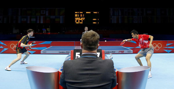 HongKong's Tang Peng (R) hits a return to Germany's Dimitrij Ovtcharov in their men's team bronze medal table tennis singles match at the ExCel venue during the London 2012 Olympic Games August 8, 2012. <STRONG>Table tennis</STRONG>: Rivals look to Rio to beat China