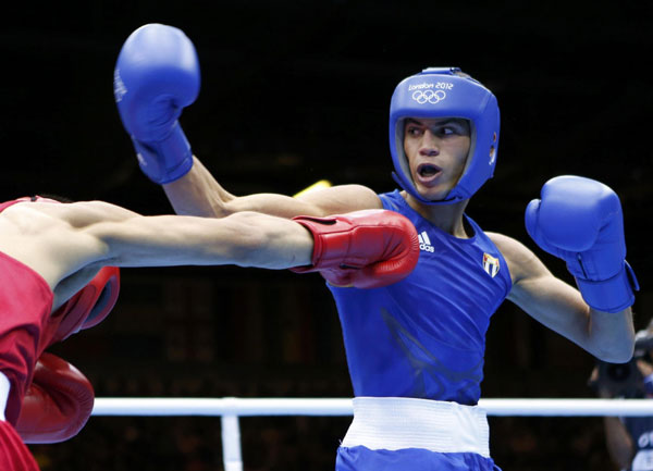 Mongolia's Tugstsogt Nyambayar (L) fights Cuba's Robeisy Ramirez Carrazana during their Men's Fly (52kg) gold medal boxing match at the London Olympics August 12, 2012. Cuban boxer wins boxing men's 52kg gold medal