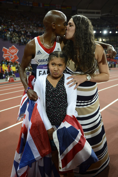 Britain's Mohamed Farah kisses his wife Tania after winning the men's 10,000 meters. Victory and spirit