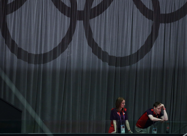 Volunteers watch a performance at break. Julie Jacobson / Associated press Volunteers find the world in their grasp