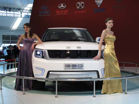 Model poses near a car by BAIC