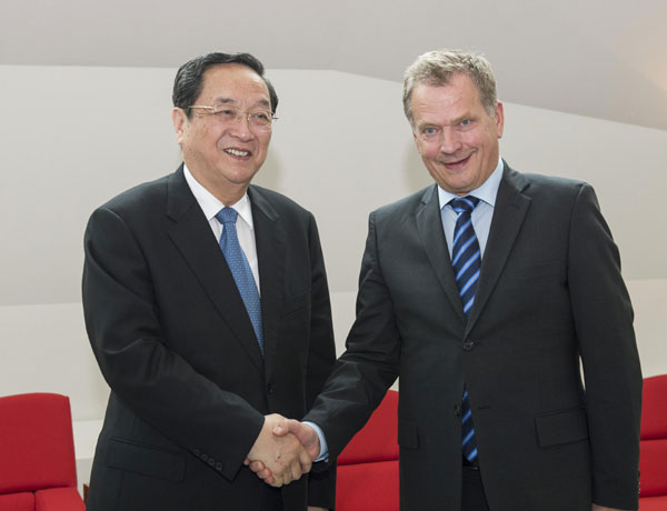 Yu Zhengsheng (L), chairman of the National Committee of the Chinese People's Political Consultative Conference, meets with Finnish President Sauli Niinisto in Helsinki, the capital of Finland, May 31, 2013. China, Finland stress importance of free trade