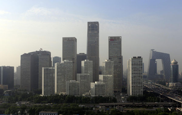 Buildings are seen in Beijing's central business district, July 11, 2013. China's home prices continue to rise