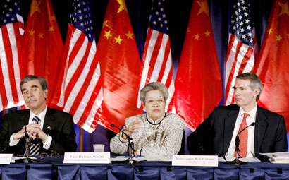 U.S. Secretary of Commerce Carlos Gutierrez (L), Chinese Vice Premier Wu Yi (C) and U.S. Trade Representative Rob Portman attend a news conference following the annual U.S.-China Joint Comission on Commerce and Trade meeting in Washington April 11, 2006.