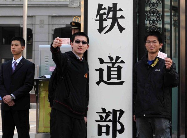 Visitors take photos in front of the defunct Ministry of Railways in Beijing, March 14, 2013. Keepsake photos of Railway Ministry