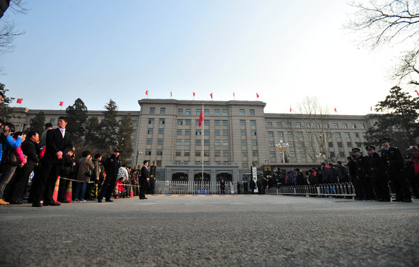 People line up to take photos in front of the Railway Ministry before it is dismantled, March 14, 2013. Keepsake photos of Railway Ministry