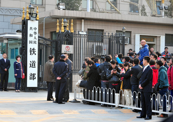 People line up to take photos with the sign for the Railway Ministry, March 14, 2013. Keepsake photos of Railway Ministry