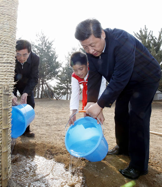 President Xi Jinping waters a newly planted tree in Fengtai district, Beijing, on Tuesday, in a move to improve public awareness of environmental protection. Photo by Ju Peng / Xinhua Xi gives green light for planting