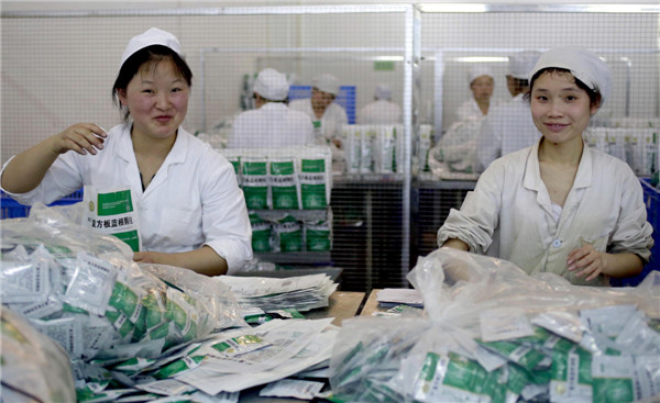 Workers in the packaging department of De Chang Xiang Co, one of the leading producers of traditional Chinese medicine in Guizhou province. Feng Yongbin / China Daily Economic transformation bears fruit in Guizhou