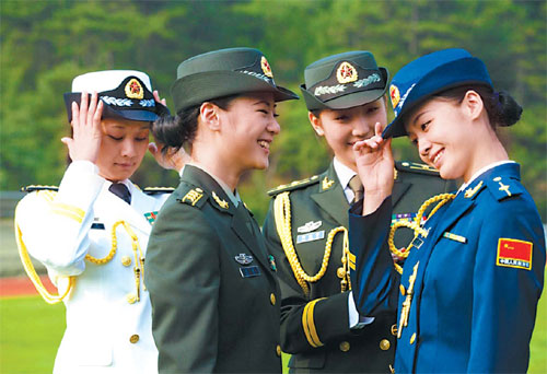 Female officers from the air force, army and navy wearing their new 2007 style uniforms to celebrate the PLA's 80th anniversary.[Yuan Xuejun]