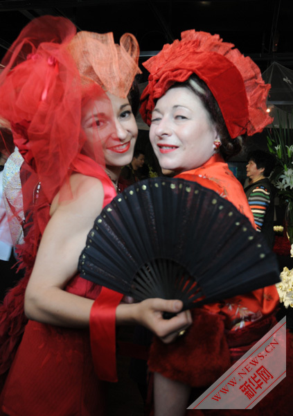 Bold scarlet , wild Versailles roses highlight in French Pavilion