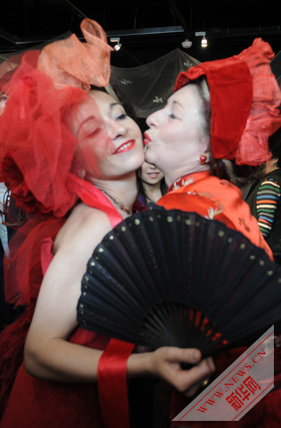 Bold scarlet , wild Versailles roses highlight in French Pavilion