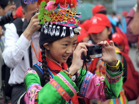 Children walk out of mountain for Expo