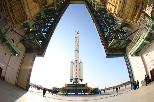 A Long March II-F carrier rocket loaded with 'Tiangong-1', an unmanned space module, is moved to the launch pad at Jiuquan Satellite Launch Center, Sept 20, 2011. Countdown to China's space station begins