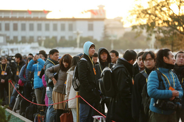 Journalists wait outside the Great Hall of the People, the venue of the opening ceremony of the 18th National Congress of the Communist Party of China (CPC), at the Tian'anmen Square in Beijing, capital of China, Nov 8, 2012. Journalists cover opening ceremony of CPC congress