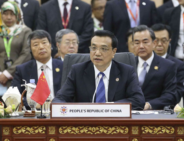 Premier Li Keqiang attends a summit with leaders from ASEAN, China, Japan and South Korea in Bandar Seri Begawan, Brunei, on Oct 10, 2013. Asian 'safety net' stressed
