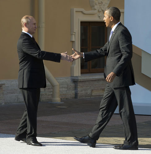 U.S. President Barack Obama (R) and Russia's President Vladimir Putin shake hands during arrivals for the G20 summit at the Konstantin Palace in St. Petersburg, September 5, 2013. Obama, Putin meet for G20 at St petersburg