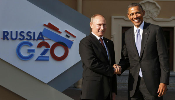 Russia's President Vladimir Putin (L) welcomes U.S. President Barack Obama before the first working session of the G20 Summit in Constantine Palace in Strelna near St. Petersburg, September 5, 2013. Obama, Putin meet for G20 at St petersburg