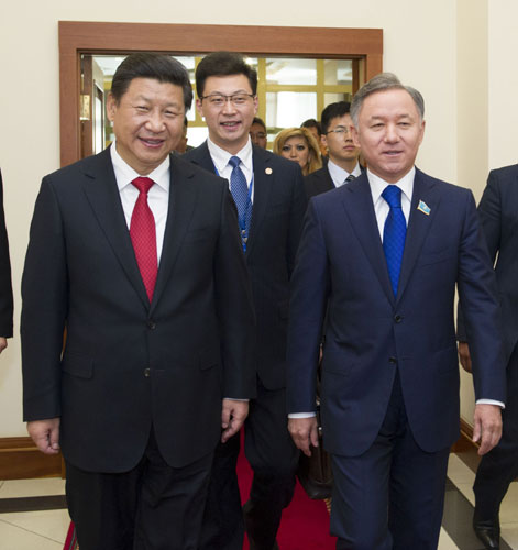 President Xi Jinping (L) meets with speaker of Kazakh Parliament's Lower House Nurlan Nigmatulin in Astana, Kazakhastan, Sept 7, 2013. Xi discusses bilateral ties with Kazakh parliament speaker