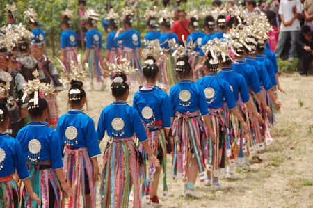 Miao people perform traditional group dance 