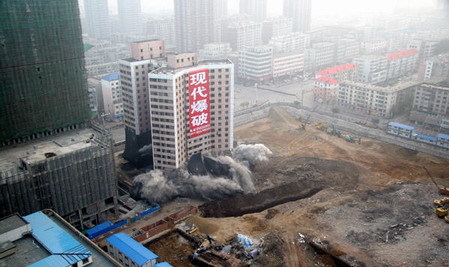Once landmark tower brought down in planned explosion