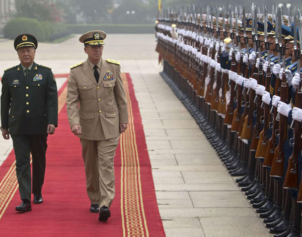 General Chen Bingde (L), chief of the General Staff of the Chinese People's Liberation Army, and US Admiral Mike Mullen, chairman of the Joint Chiefs of Staff, review an honor guard together during a welcoming ceremony for Mullen at the Bayi Building in Beijing July 11, 2011. China, US announce military exchange plans