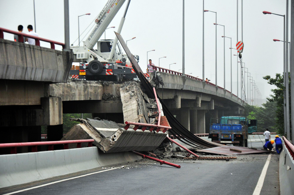 Truck driver injured in bridge cave-in Truck driver injured in bridge cave-in