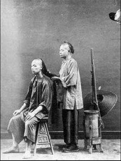 A man at the barber's during the late Qing Dynasty. Untying the knots of history