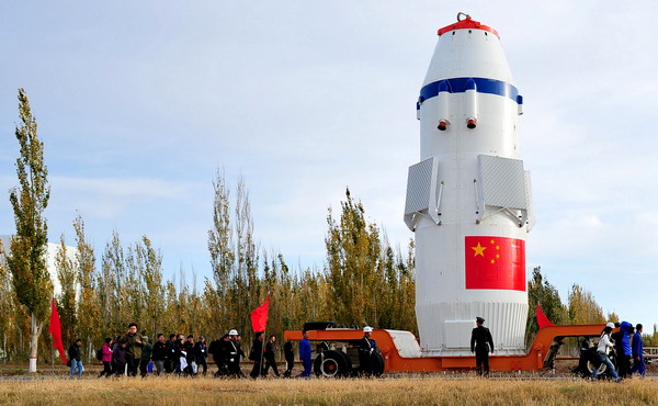 Shenzhou VIII, an unmanned spacecraft, is transported to the launch pad at Jiuquan Satellite Launch Center, A rocket will carry Shenzhou VIII into orbit on Tuesday. Shenzhou VIII off to rendezvous in space
