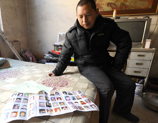 Feng Jianlin, who lost his daughter three years ago, has traveled thousands of miles across China and passed out millions of leaflets bearing the images of missing children. Yan Yan / Xinhua Long road to recovery