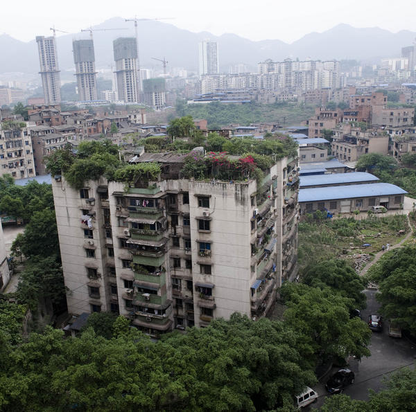 Some cities have already started greenings campaign, like this apartment in Chongqing. Planting food takes it a step further. Photo by Xinhua Country in City