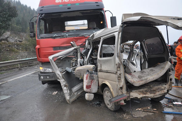 The wreck of a minibus after it collided into a truck on a highway in Guizhou, Feb 9, 2012. 7 killed in traffic accident in SW China