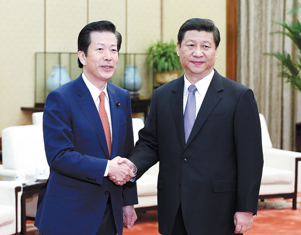 Top leader Xi Jinping greets Natsuo Yamaguchi, party leader of Japan’s New Komeito, in Beijing on Friday, in a meeting that analysts said could help ease tensions over the Diaoyu Islands. Xi calls to solve 'sensitive issues' in China-Japan ties