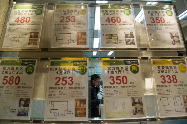 Houses for sale are advertised at a real estate agency in Beijing. The municipal government announced detailed rules on Saturday aimed at cooling the property market. LUO XIAOGUANG / XINHUA 2 cities in bid to cool real estate market