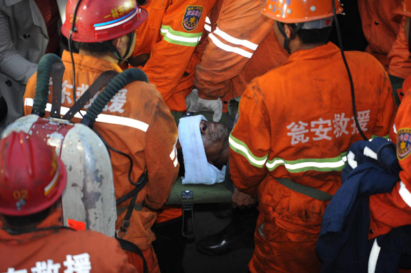 A miner is rescued after being trapped for 60 hours in a flooded coal mine, in Weng'an, Guizhou province, April 8, 2013. 3 rescued from flooded coal mine in SW China