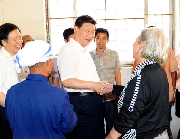 President Xi Jinping (C) talks with local citizens in Xibaipo, an old revolutionary base, in North China's Hebei province. Xi made an inspection tour of Hebei province from July 11 to 12. Xi urges CPC members to keep China red