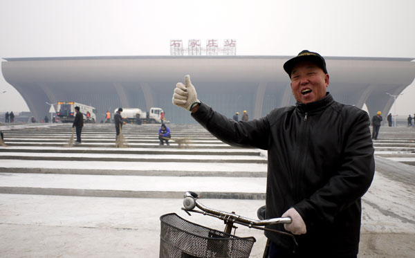 A resident shows his appreciation of Shijiazhuang's new railway station. Railway cities staying on track