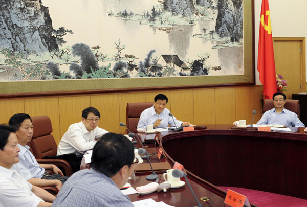 Liu Yunshan (2nd R), a member of the Standing Committee of the Political Bureau of the Communist Party of China (CPC) Central Committee, presides over the second meeting of a leading team of a campaign aimed to strengthen the ties between the CPC and the public, in Beijing, July 5, 2013. Senior official calls for 'quality' mass line campaign