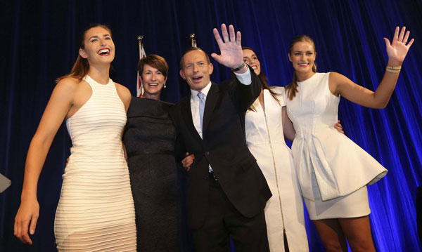 Australia's conservative leader Tony Abbott (C) stands with his wife Margaret (2nd L) and daughters (L-R) Frances, Louise and Bridget as he claims victory in Australia's federal election during an election night function in Sydney September 7, 2013. Premier Li congratulates new Australian PM