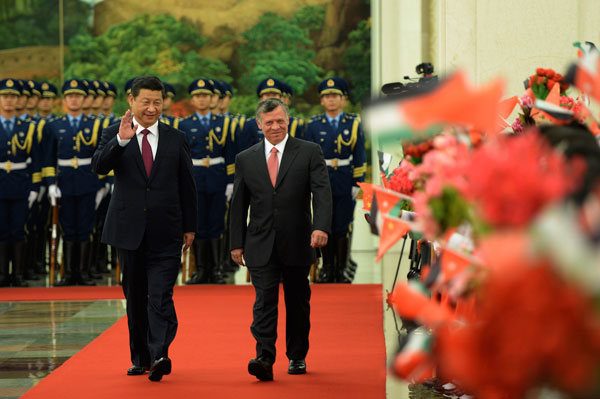 Chinese President Xi Jinping holds a welcome ceremony for Jordanian King Abdullah II before their talks at the Great Hall of the People in Beijing, Sept 18, 2013. Chinese president, Jordanian king hold talks
