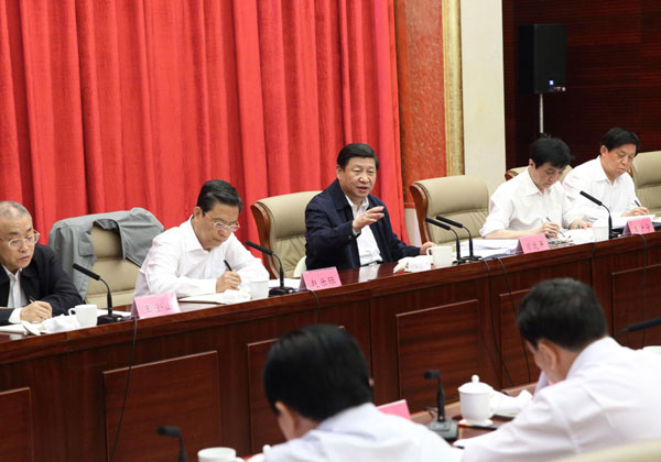 Xi Jinping (back, C), Chinese president and general secretary of the Communist Party of China Central Committee, participates in a session as part of the ongoing 'mass line' campaign with standing committee members of the Party Committee of North China's Hebei province, in Shijiazhuang, the capital of Hebei, Sept 23, 2013. Xi stresses CPC criticisms, self-criticisms