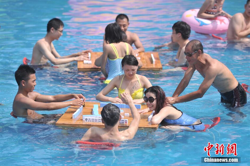 Beating the heat with mahjong, water fights and massage