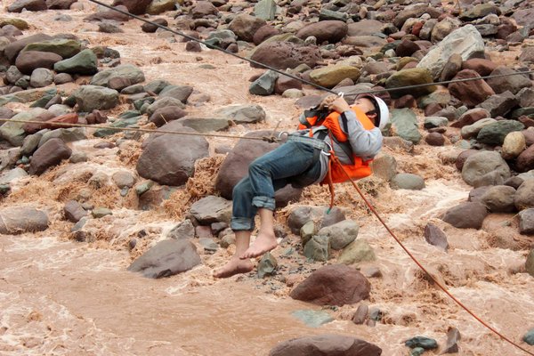 Rescuers pluck residents from raging torrent
