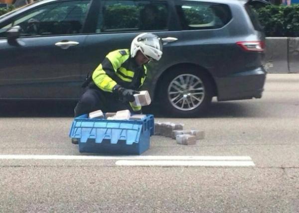 Armor van spills $4m on road in HK