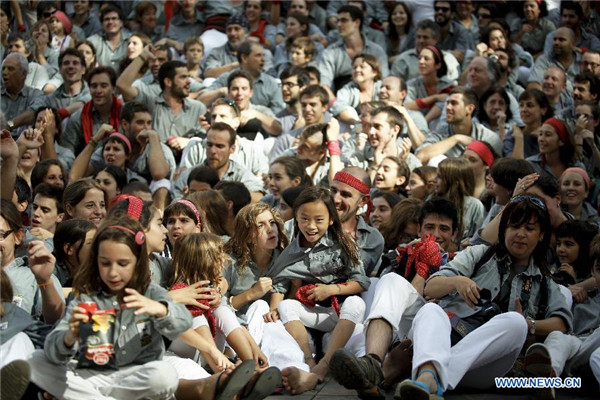 Chinese girl in local Spanish human tower team